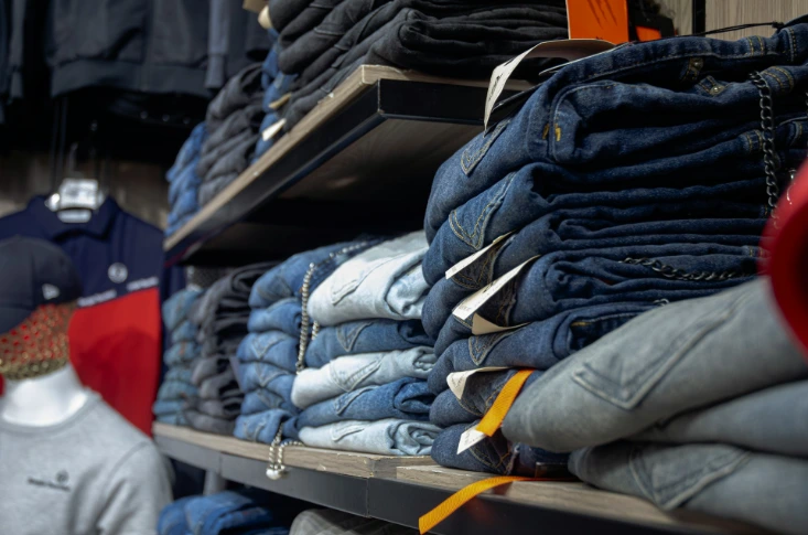 a rack of jeans in a clothing store